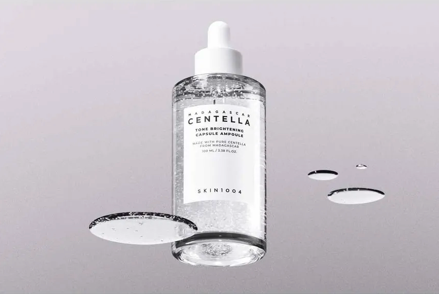 Skincare bottle with dropper on a gray background