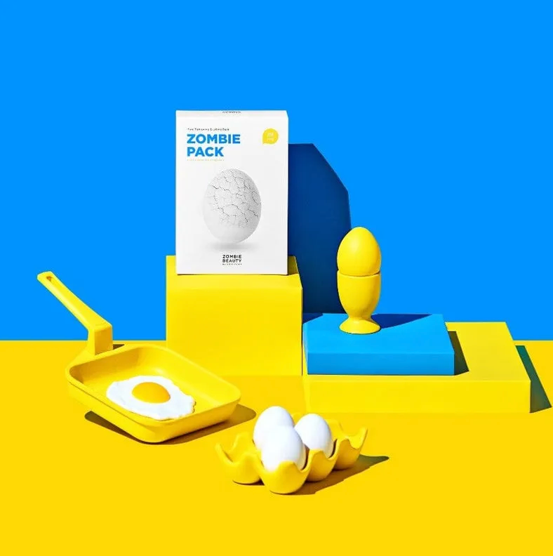 Yellow egg-shaped product with packaging labeled 'Zombie Pack' on a blue and yellow background