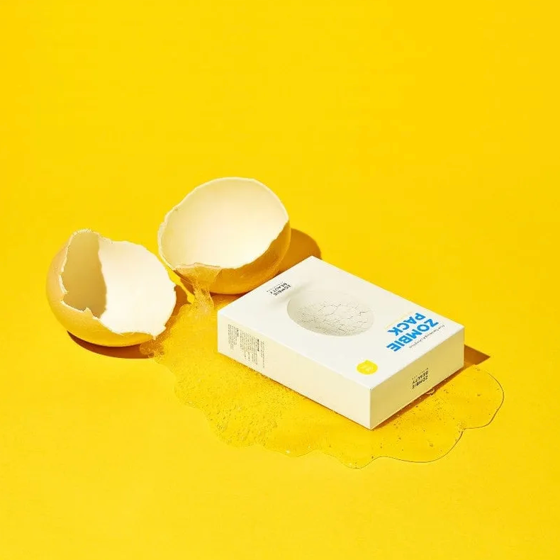 Box with a cracked shell on a yellow background