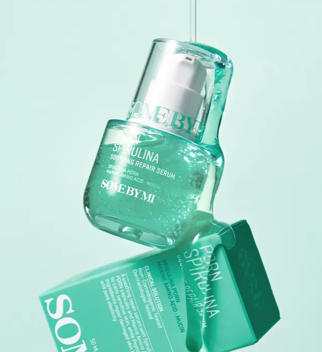 Sculpted serum bottle with packaging on a light blue background
