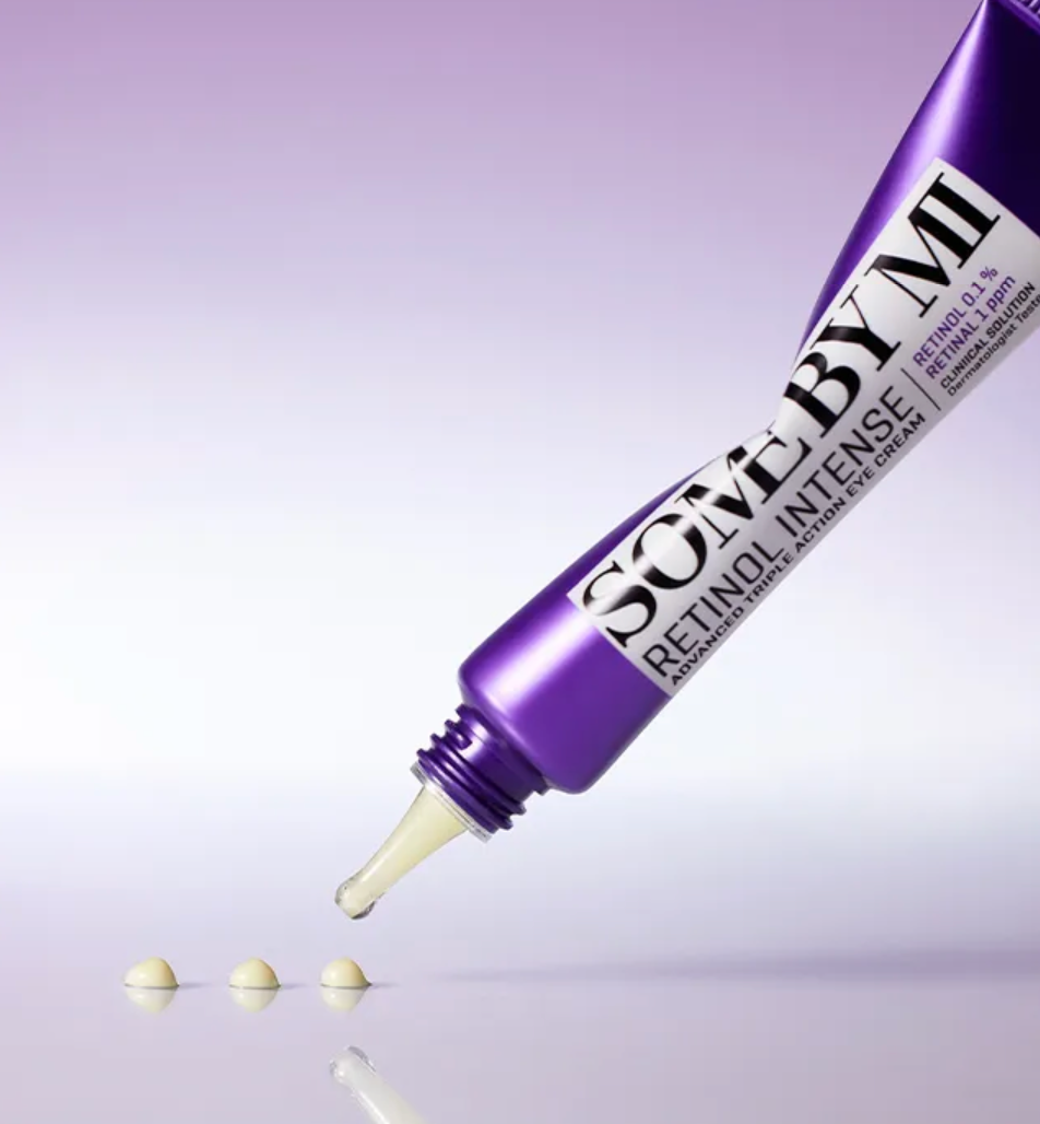 Purple tube labeled 'SOME BY MI' with a white applicator on a light purple background