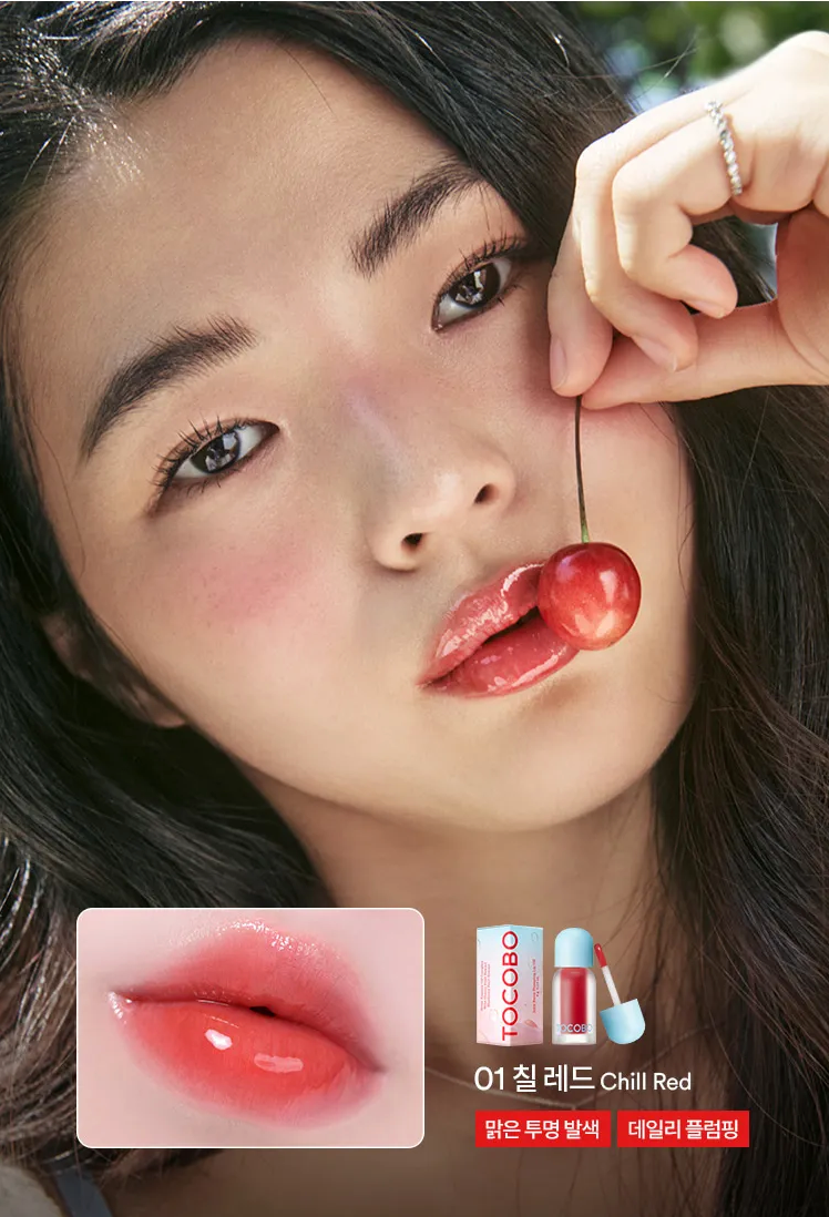 Woman with a lipstick swatch and Tocoto lip products displayed