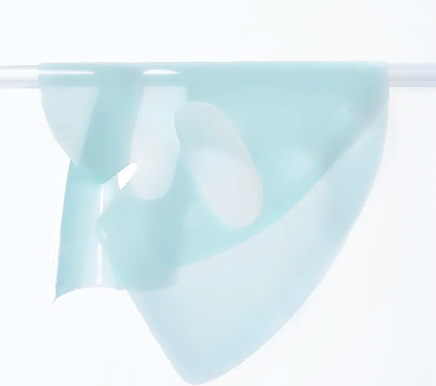 Light blue fabric draped over a white background