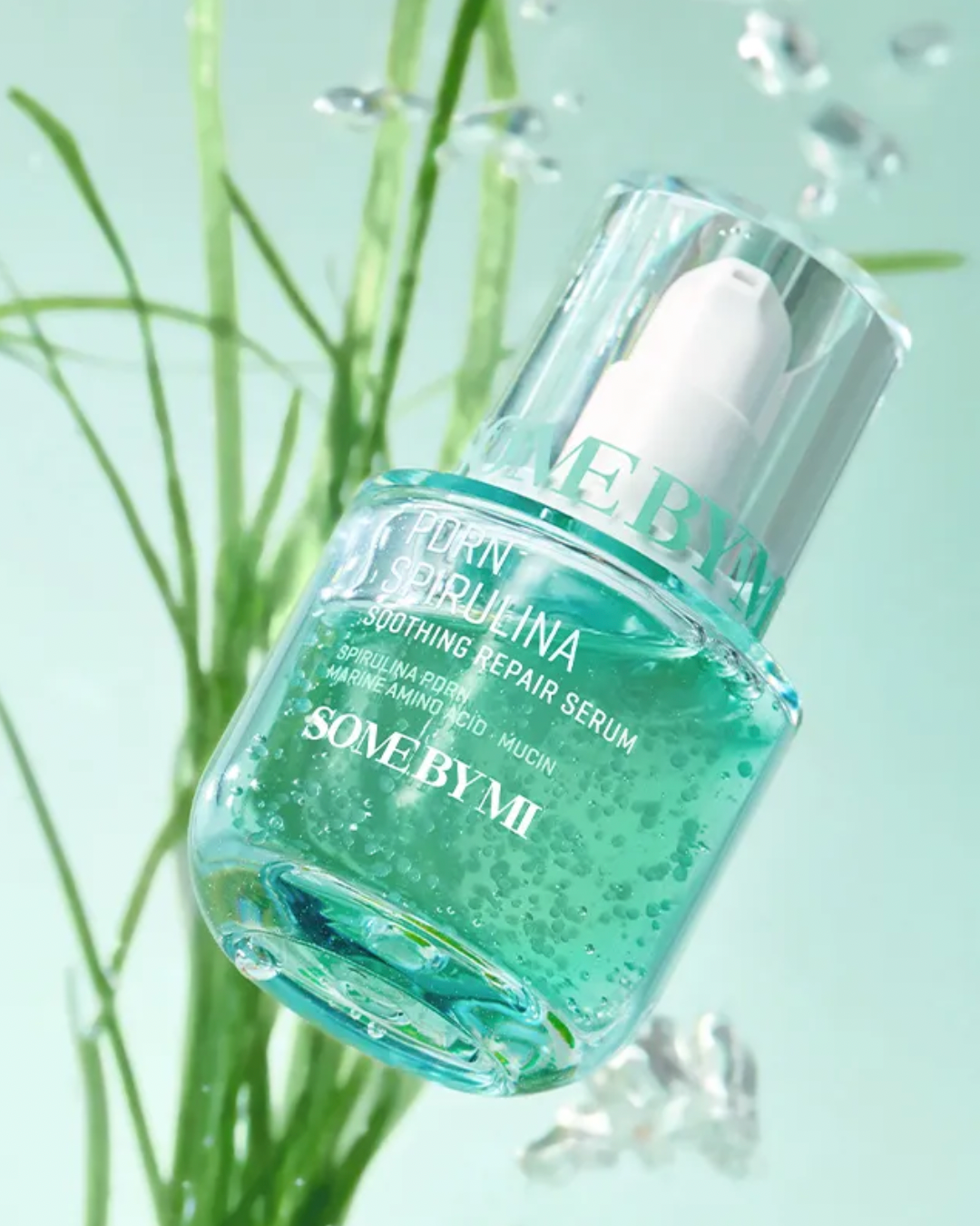 Some By Mi serum bottle with green liquid on a light green background