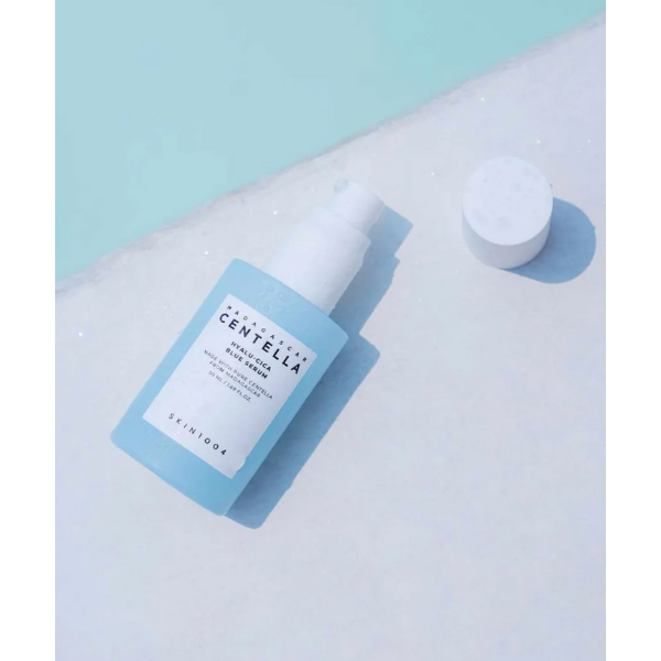 Skincare product with blue label on a light blue background