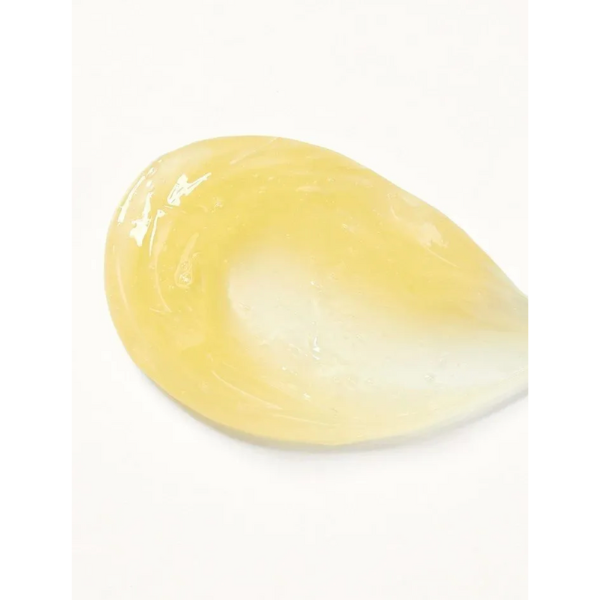 Yellow teardrop-shaped object on a white background