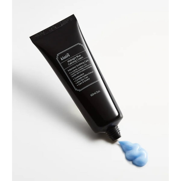 Black tube of Klairs cream with a small amount of blue cream on a white background