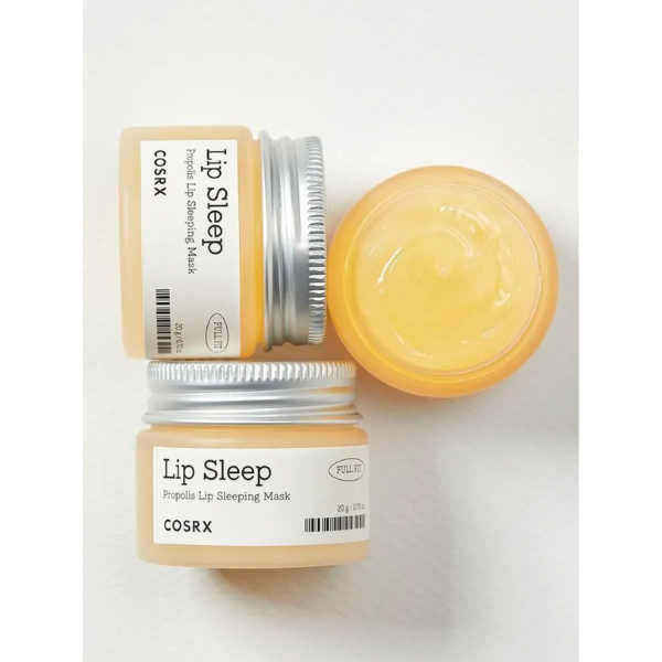 Two containers of COSRX Lip Sleep lip sleeping mask on a white background
