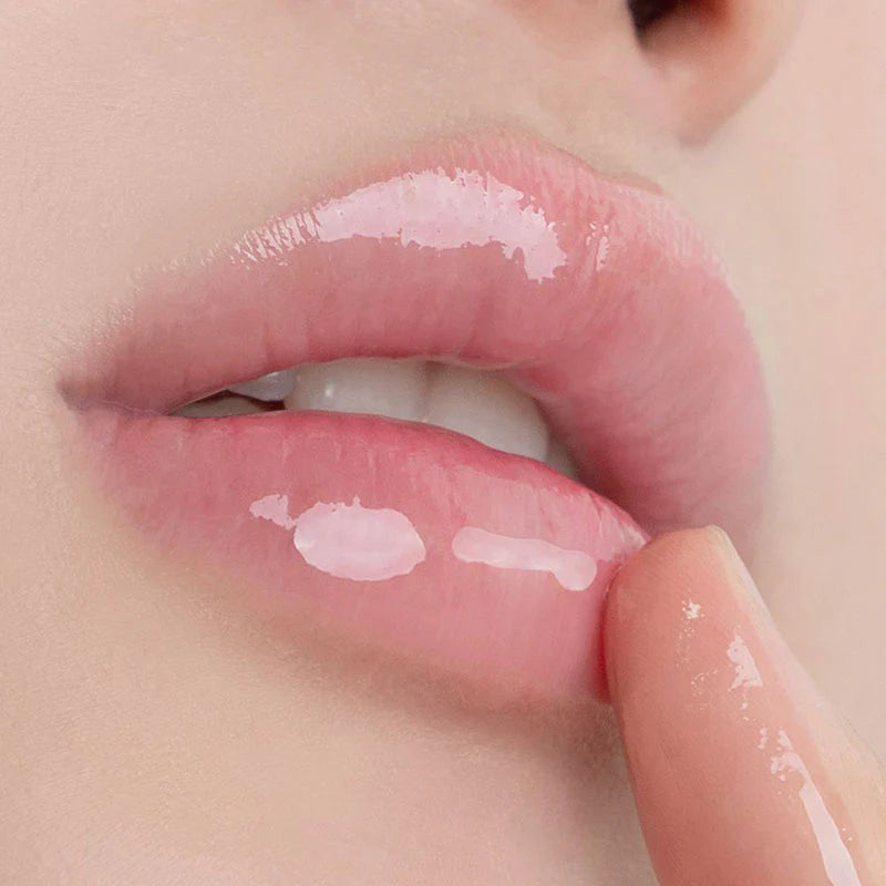 Close-up of lips with a light pink lip balm applied