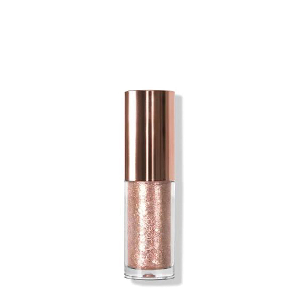 Rose gold glittery nail polish bottle on a white background