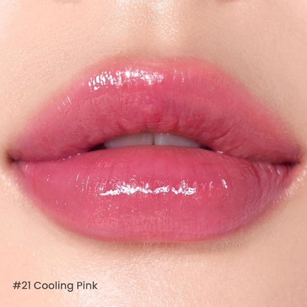 Close-up of lips with a glossy pink lipstick labeled '#21 Cooling Pink'.