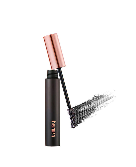 Black mascara with rose gold cap on a white background