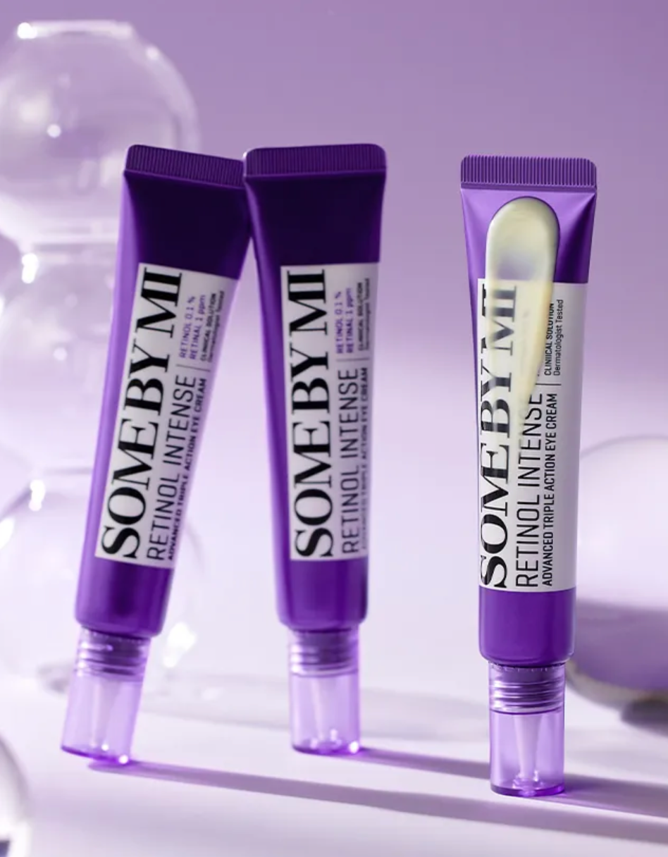 Three 'Some By Mi' retinol intense skincare products on a light purple background