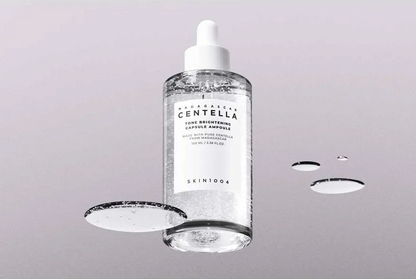 Skincare bottle with dropper on a gray background