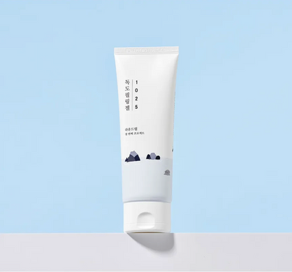 White tube with text and graphics on a light blue background