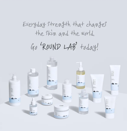Collection of Round Lab skincare products on a light gray background with promotional text.