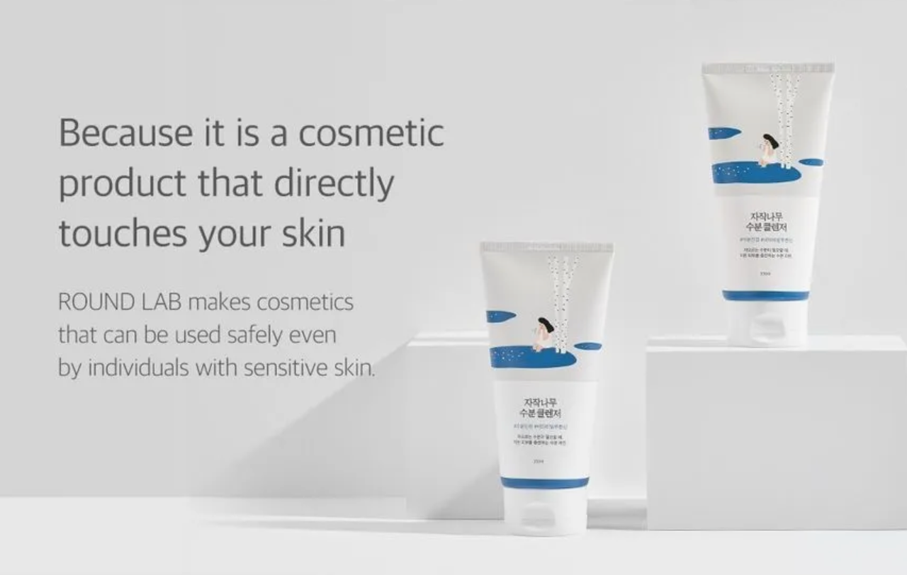 Two cosmetic tubes with a gray background and text about safety for sensitive skin.