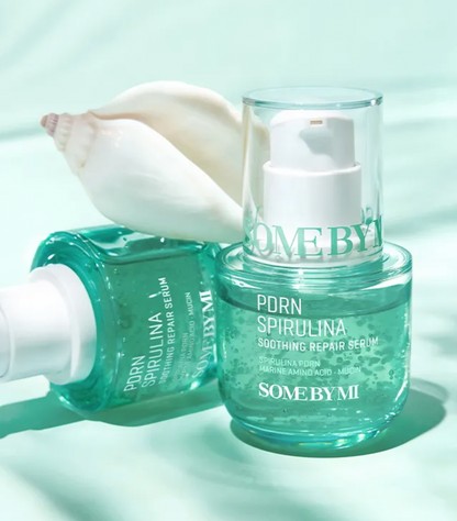 Two bottles of 'Some by Mi' PDRN Spirulina Soothing Repair Serum on a light green background