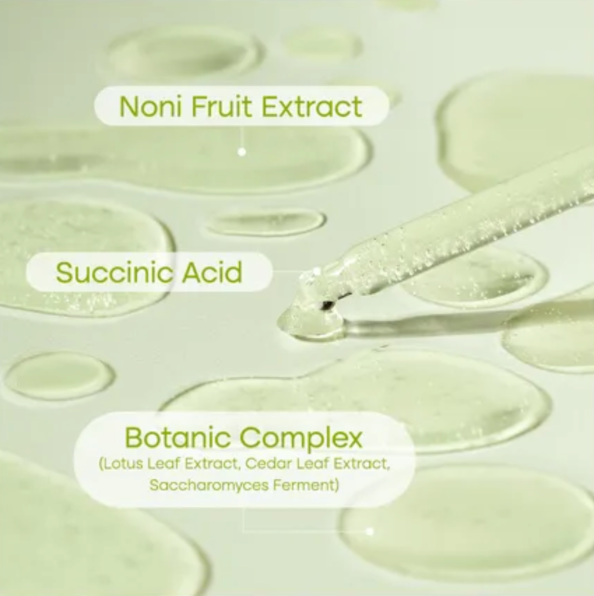 Skincare product with labeled Noni Fruit Extract, Succinic Acid, and Botanic Complex on a light background.