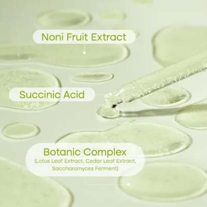 Skincare product with labeled Noni Fruit Extract, Succinic Acid, and Botanic Complex on a light background.
