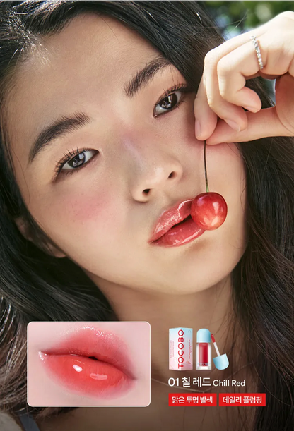 Woman with a lipstick swatch and Tocoto lip products displayed