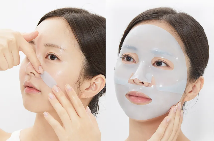 Woman applying a face mask on a white background