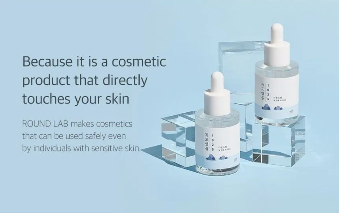 Two cosmetic dropper bottles on a light blue background with text about safety for sensitive skin.