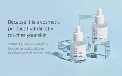 Two cosmetic dropper bottles on a light blue background with text about safety for sensitive skin.