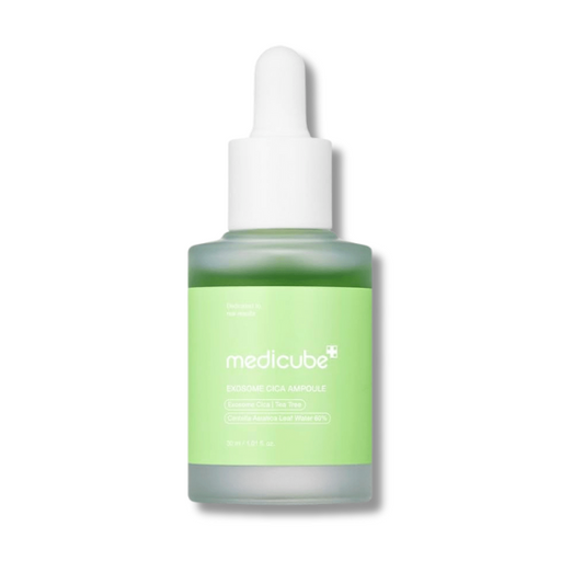 Skincare serum bottle with green label and white cap on a white background