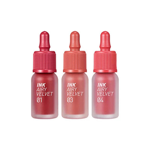 Three bottles of Ink Airy Velvet lip products on a white background