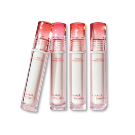 Four bottles of 'Crystal Glamour' on a white background