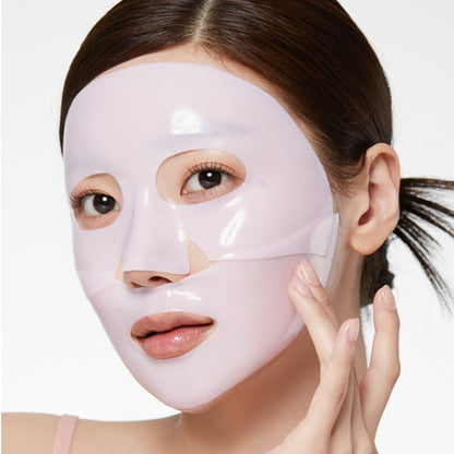 Woman wearing a pink face mask with a plain background